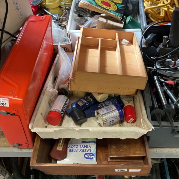 Vintage polish collection in wooden drawers, antique cleaning supplies.