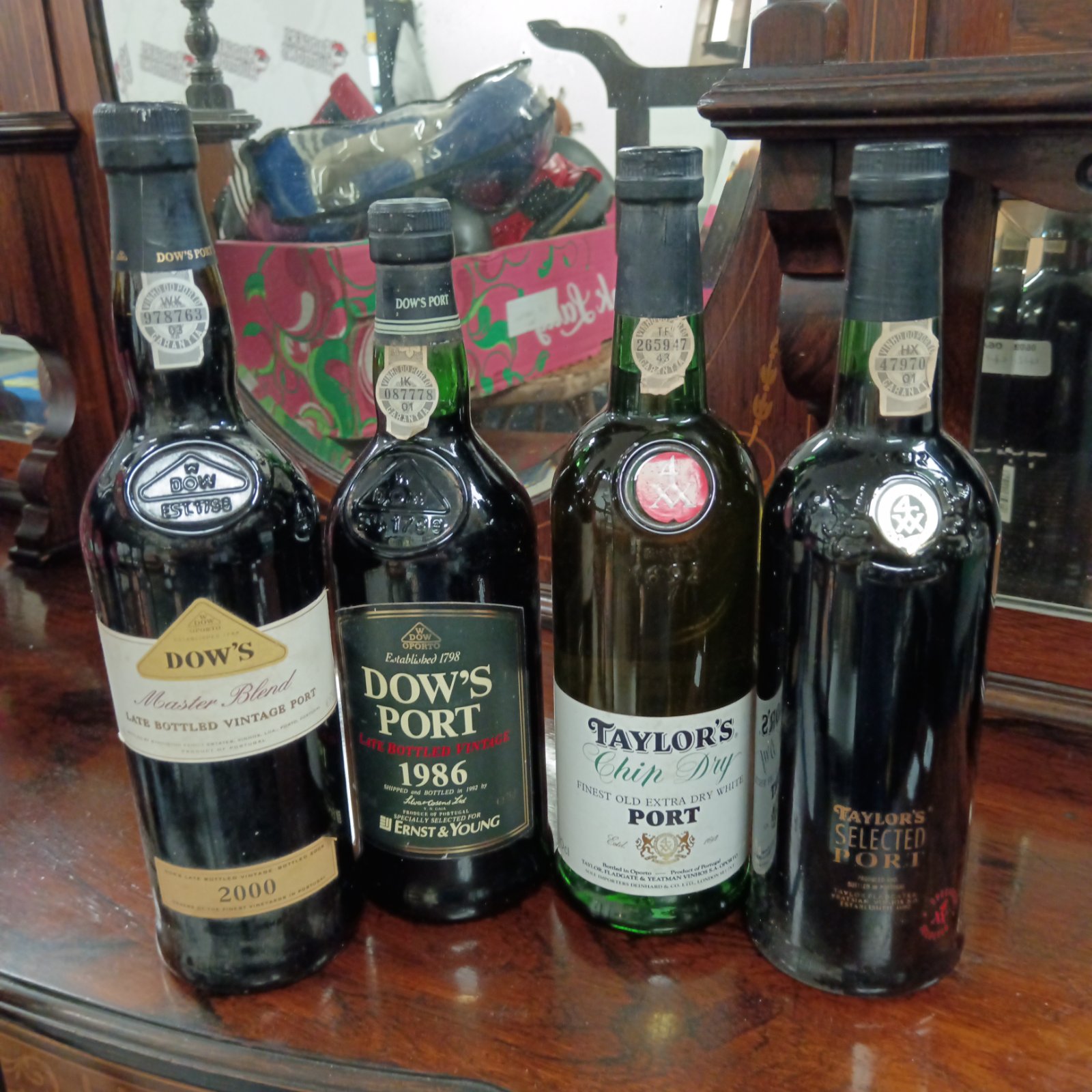 Sealed bottles of vintage Dow's and Taylor's port wine.