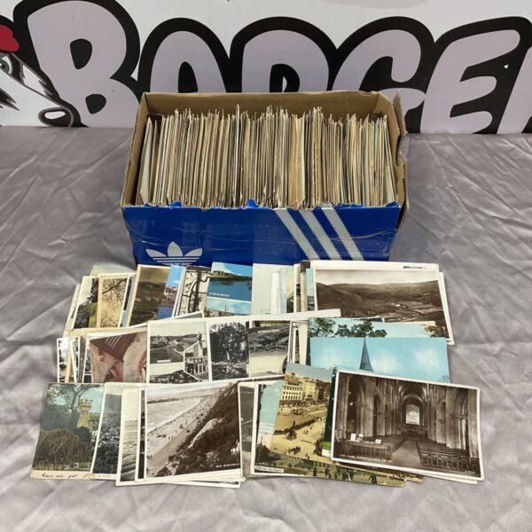 Vintage postcard collection displayed in a blue box.