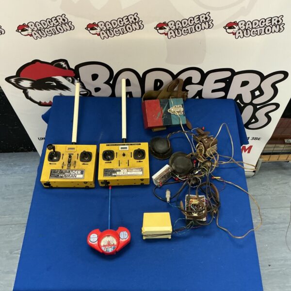 Vintage radio control transmitter with WW2 headphones, collectible electronics.