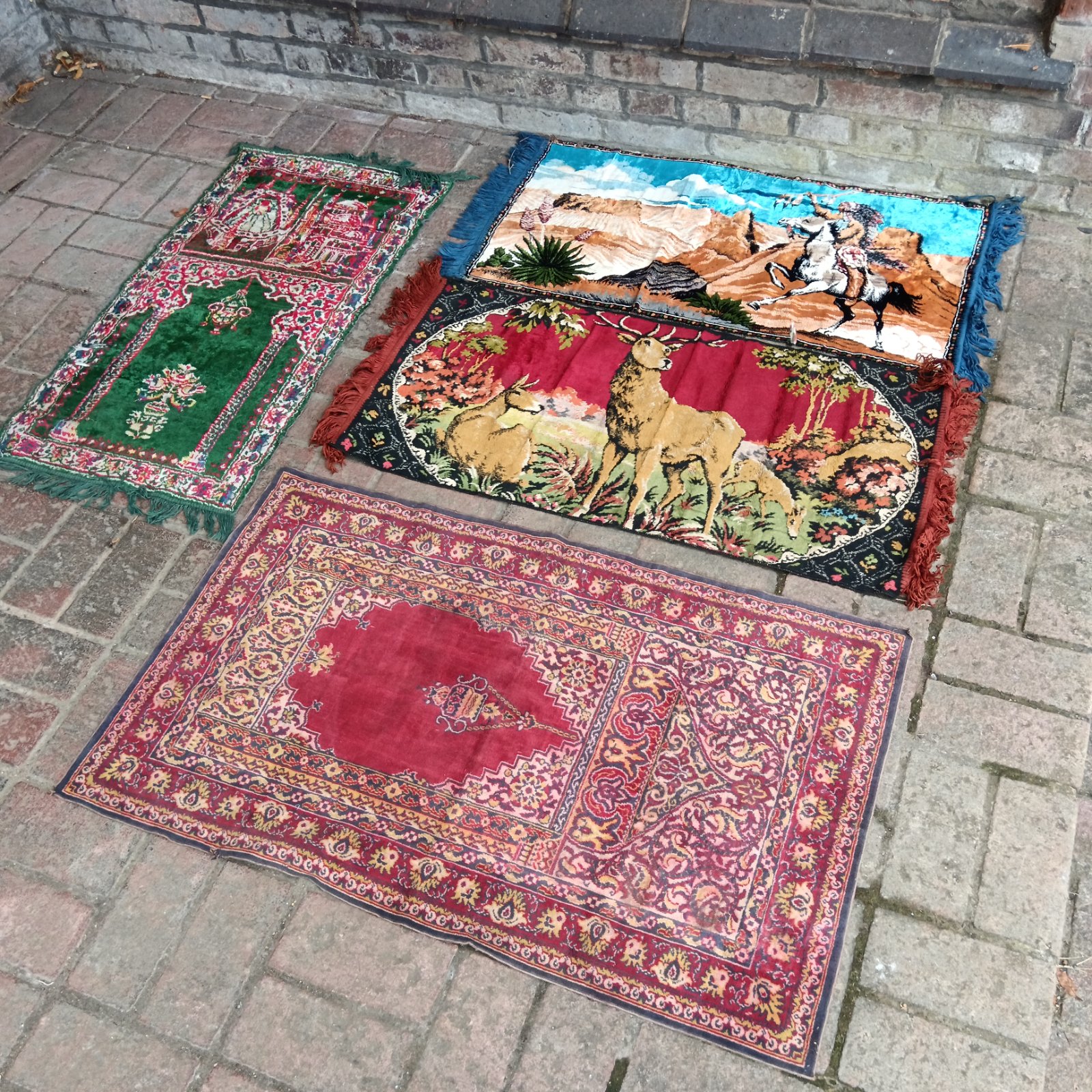 Vintage rugs featuring a silk stag and Native American design.
