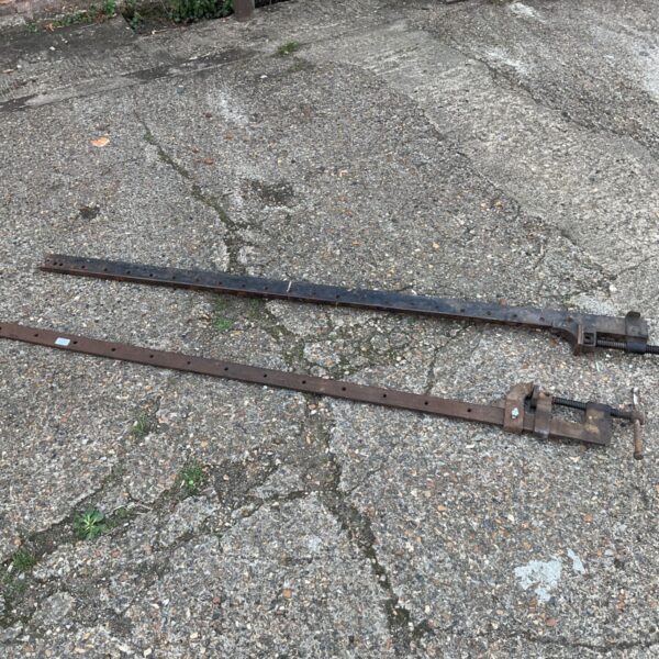 Two large vintage sash clamps for woodworking projects.