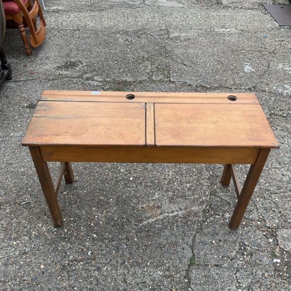 Vintage 1920s school desk with a divided desktop.