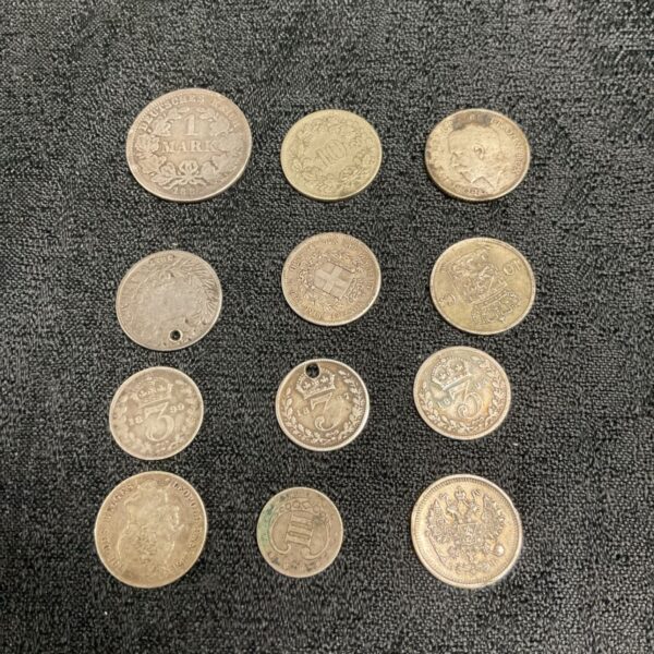 Group of vintage silver coins, including German Marks and French coins.