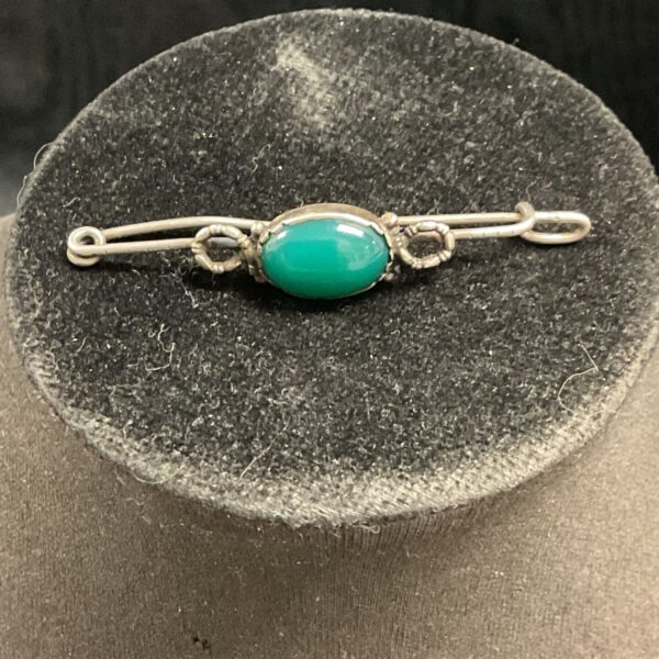 Vintage silver brooch with a green jade stone.