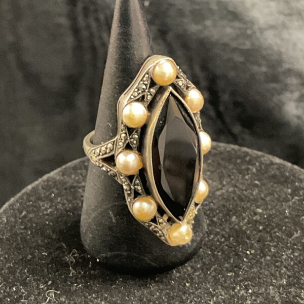 Vintage sterling silver ring with black onyx and pearls.