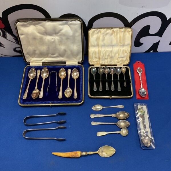 Vintage silver plate tea spoon sets in presentation cases.