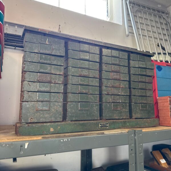 Vintage Smallbone metal drawer cabinet with multiple small drawers.