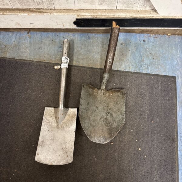 Vintage metal spade and shovel head for garden use.