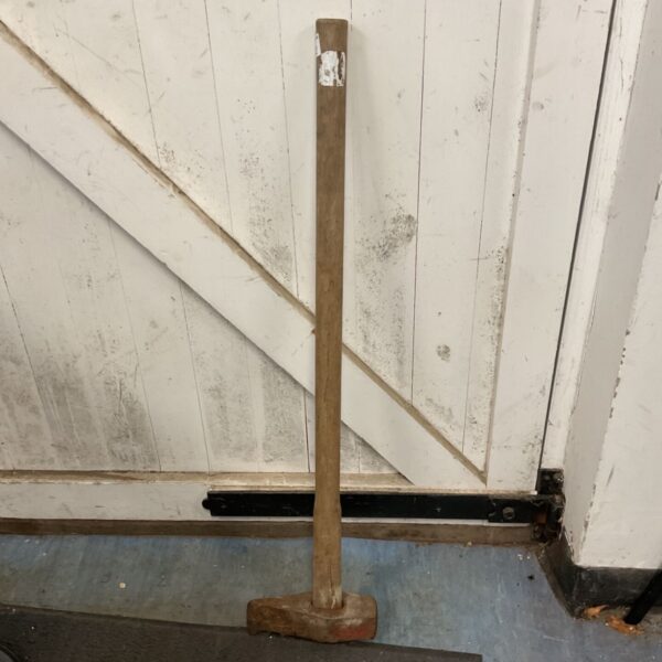 Vintage splitting axe with a weathered wooden handle and rusted head.