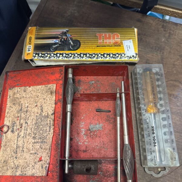 Vintage THC motorcycle chain kit with tools and original packaging.