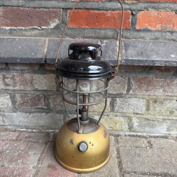 Vintage Tilley lamp with Pyrex glass, a classic collectible lantern.