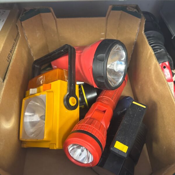 Assorted vintage torches including yellow, red and black flashlights.
