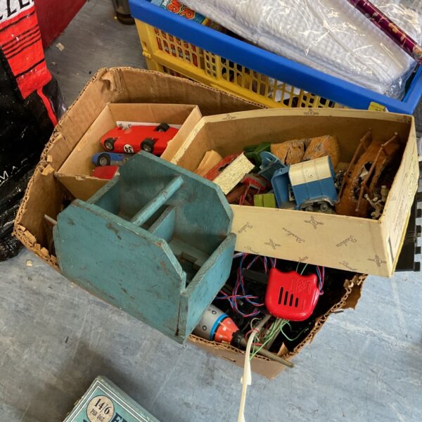 Vintage toy lot featuring Scalextric track and a tin rocket.