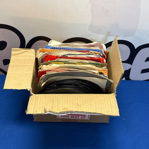 Box of vintage 7 inch vinyl records for collectors.