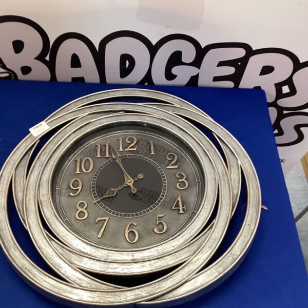 Vintage circular wall clock with black numerals for home decor.