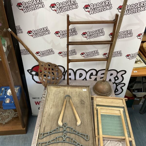 Vintage washboards and copper dolly for antique laundry cleaning.