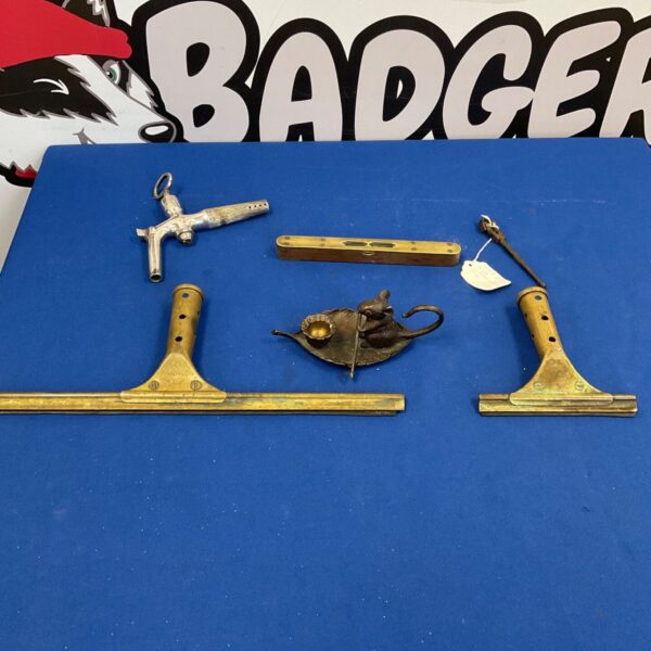 Vintage watchmaker's tool and spirit level in brass.