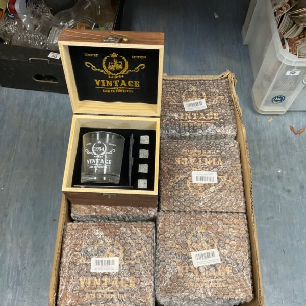 Boxed vintage whisky glass and stone sets for collectors.