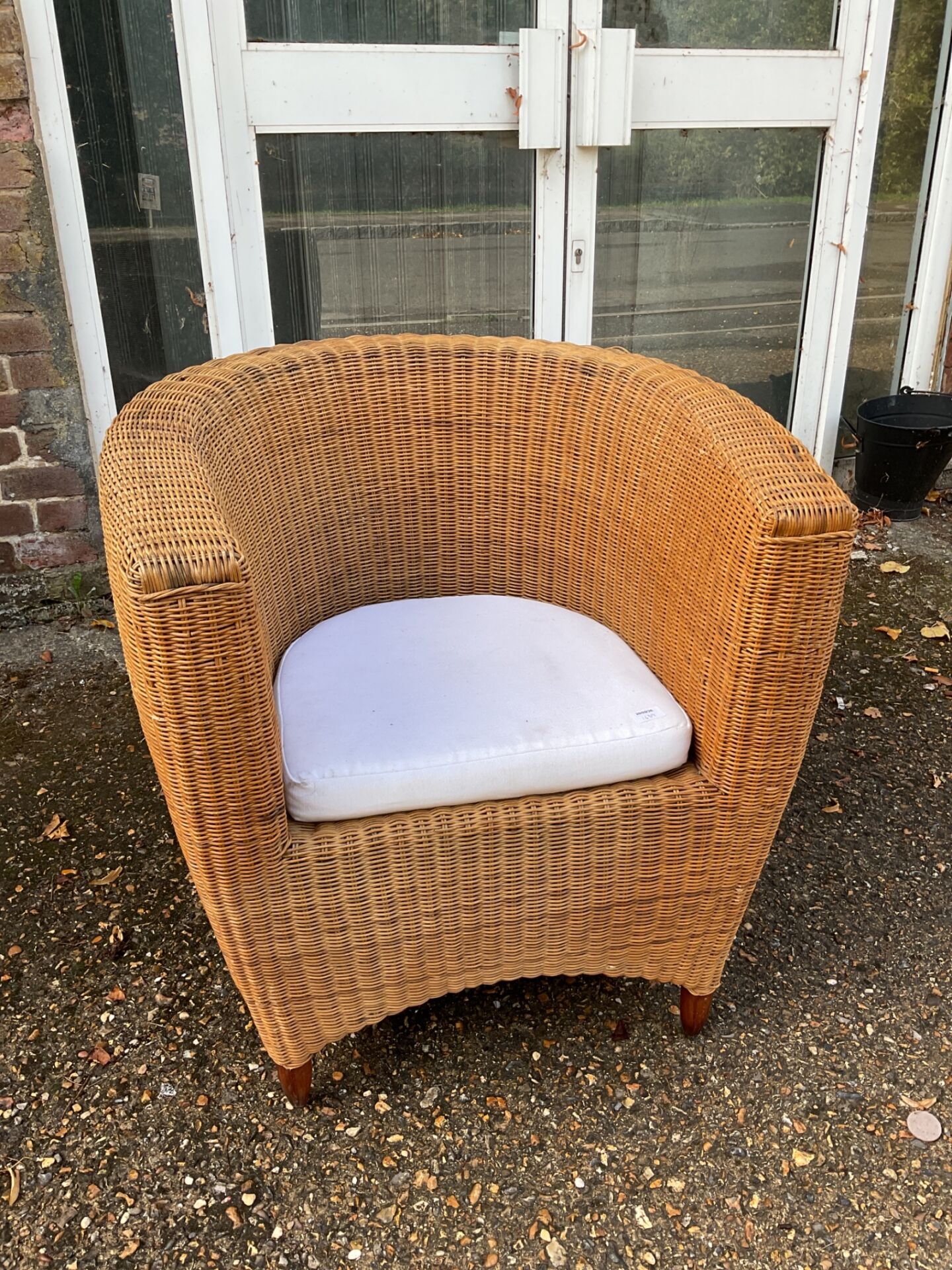 731 Vintage wicker armchair with mahogany feet