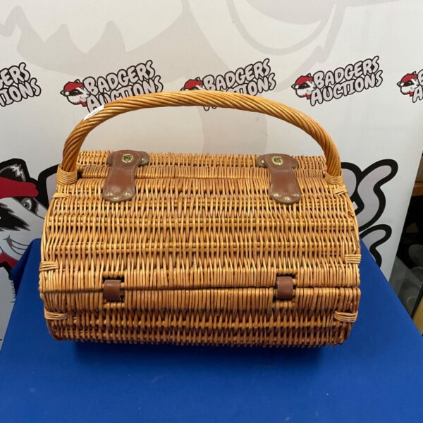 Vintage wicker picnic basket with faux fruit details.