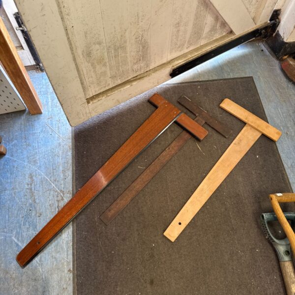Vintage wooden drafting squares for architectural drawings and scale work.