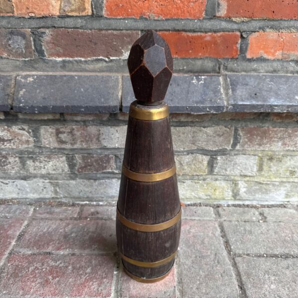 Vintage wooden flask with brass banding, antique collectible.