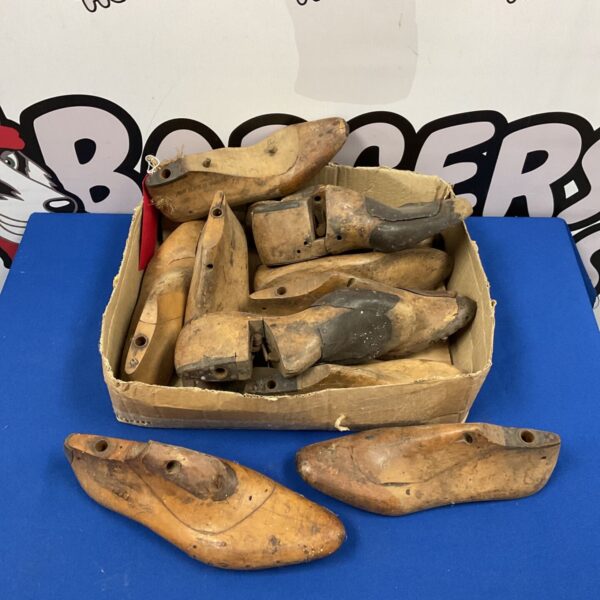Vintage wooden shoe stretchers in a collection, antique cobbler tools.