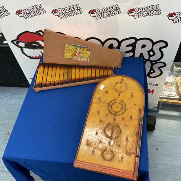 Vintage xylophone and pinball board, antique toys and games.