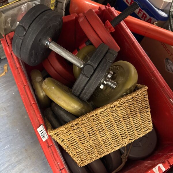 Vintage vinyl exercise weights with dumbbell bars for home fitness.
