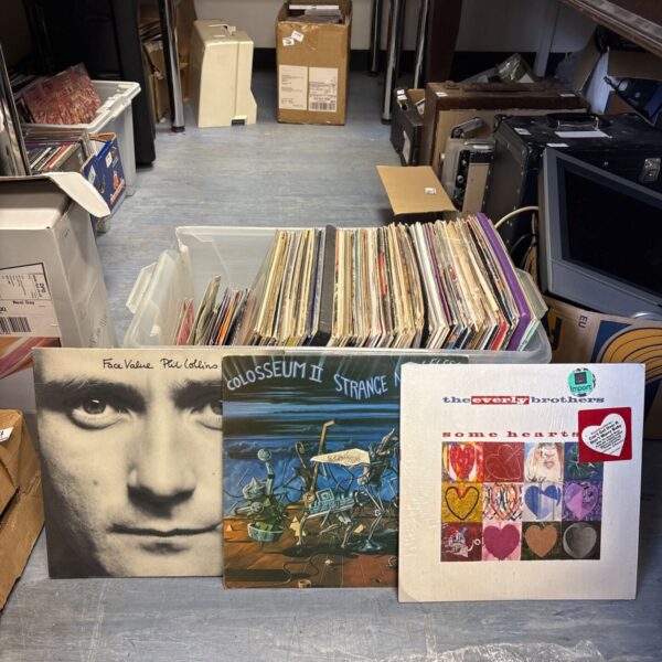 Mixed lot of vinyl records including Phil Collins album.