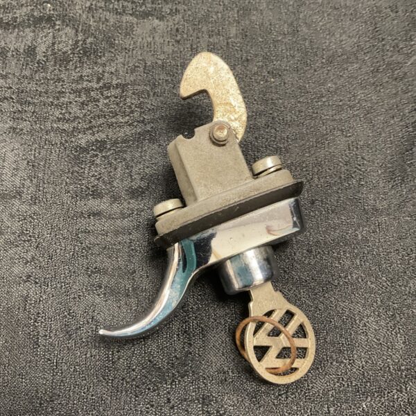 Vintage VW Camper engine cover lock with key, classic Volkswagen part.