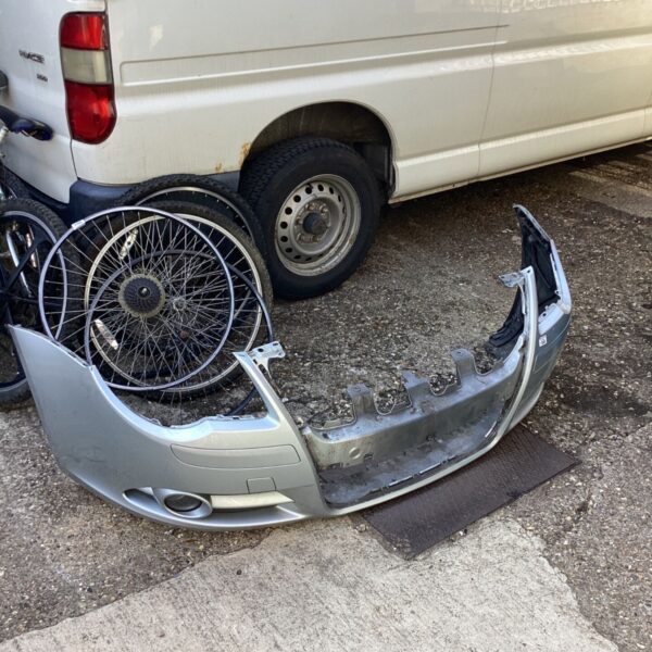 Silver VW Eos front bumper showing signs of wear.