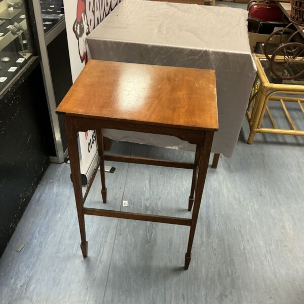 Vintage walnut side table with curved legs.