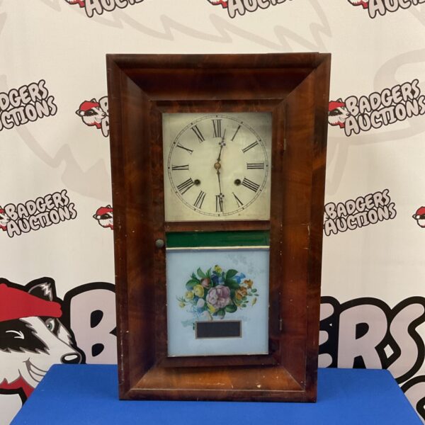 Antique Waterbury 30 hour wall clock with painted face.