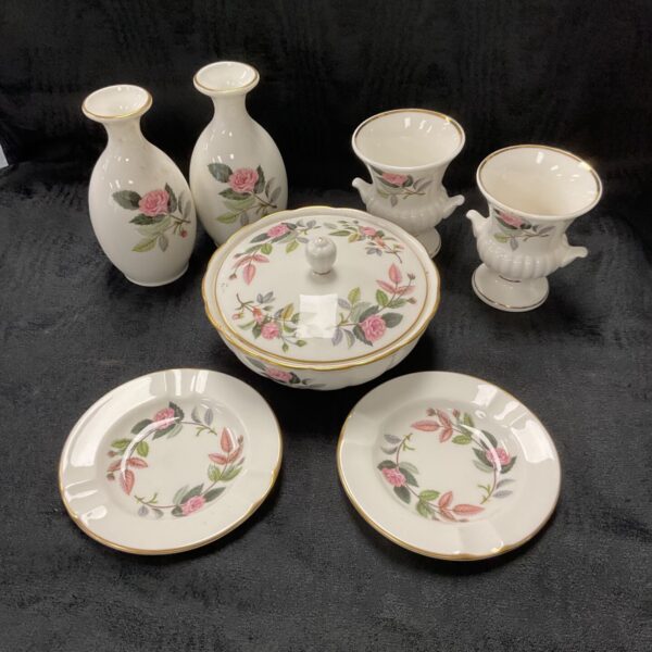 Wedgwood Hathaway Rose bone china collection on black background.