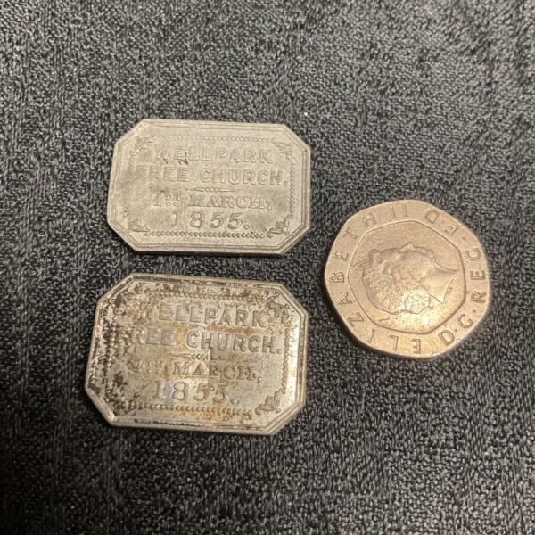 Antique Wellpark Free Church token from 1855, close-up view.