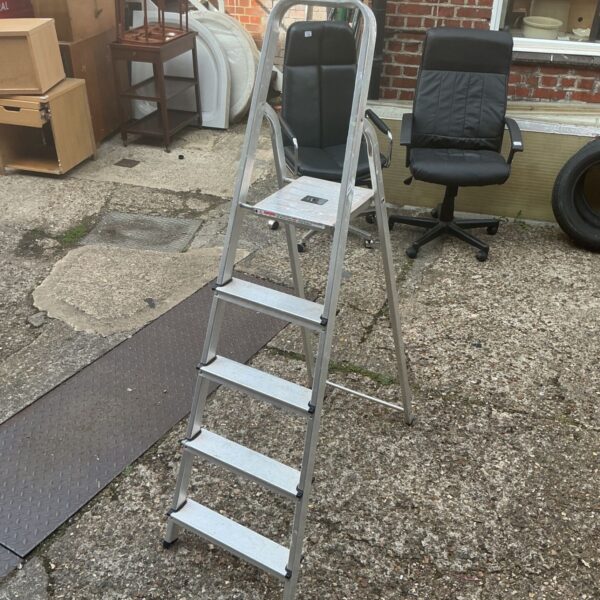 Werner Abru aluminum step ladder with three steps.