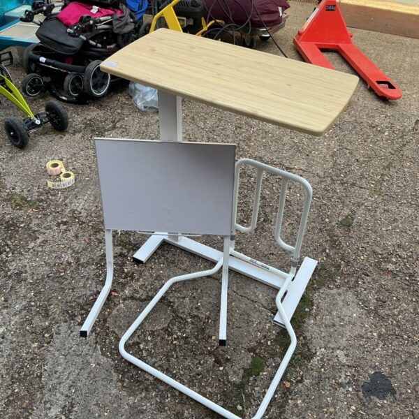 White adjustable bed rest table with metal legs.