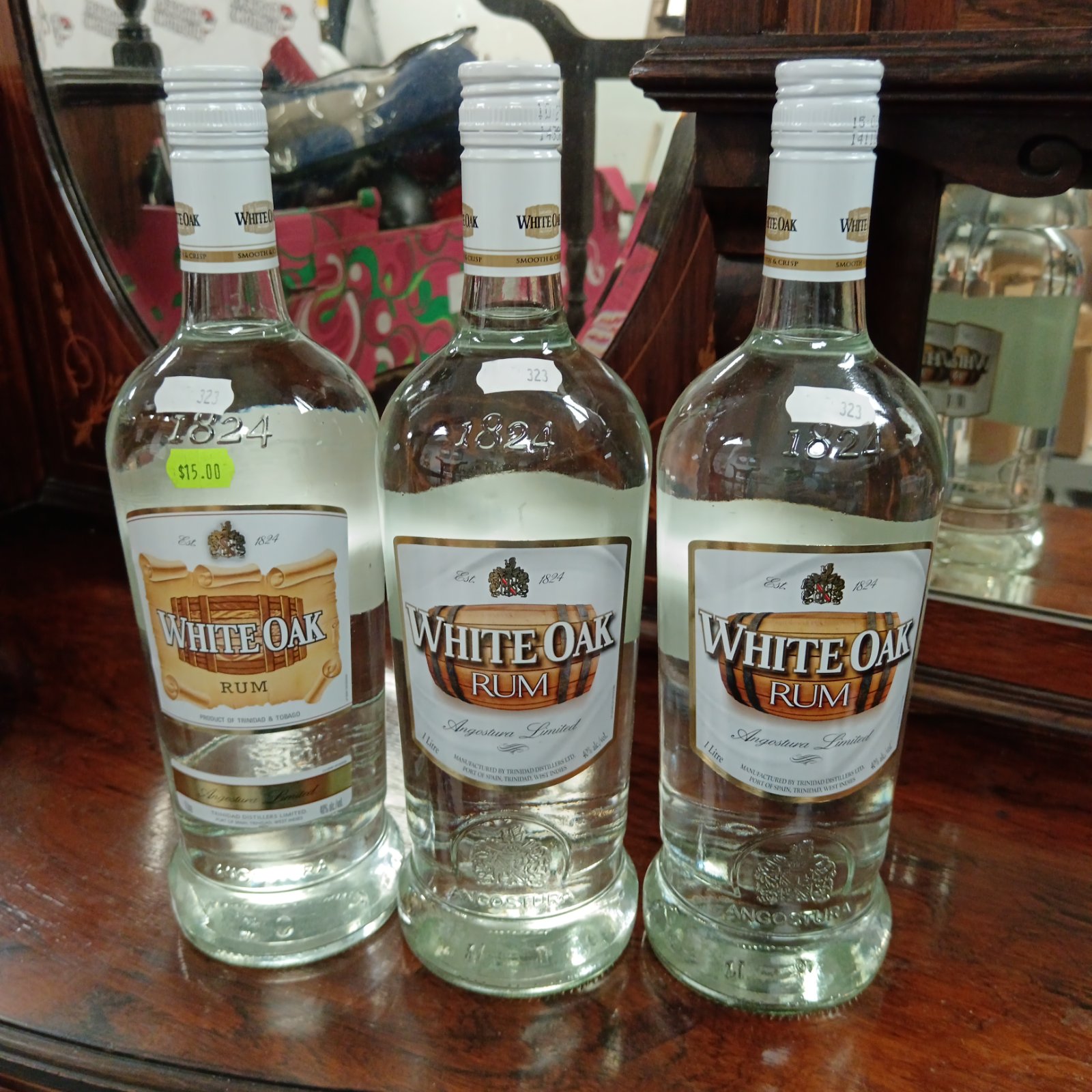 Three sealed bottles of White Oak Rum from 1824.