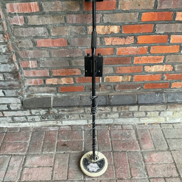 Vintage Whites Coinmaster metal detector standing upright.