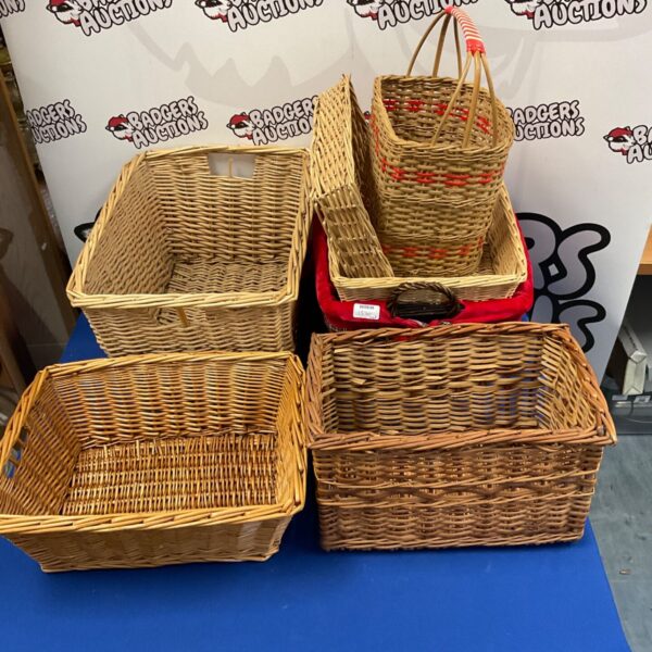 Assorted vintage wicker baskets for storage and display.