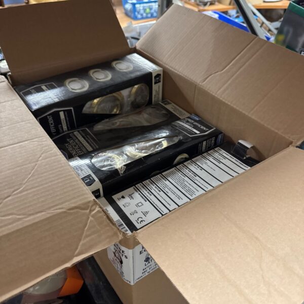 Box of new Wickes 11W downlight sets for recessed lighting.