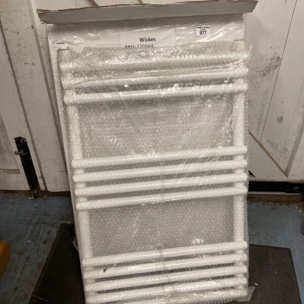 White Wickes radiator in protective packaging, ready for installation.