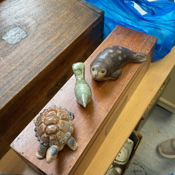 Vintage wildlife figurines including Wade tortoise and WWF seal.