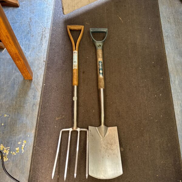 Vintage garden tools set including Wilkinson Sword spade and Moulton Mill fork.