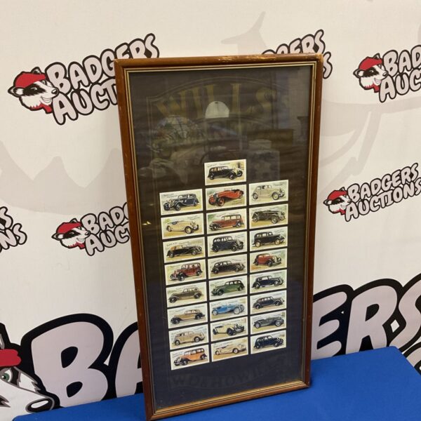 Framed set of vintage Wills Taddy cigarette cards depicting classic cars.