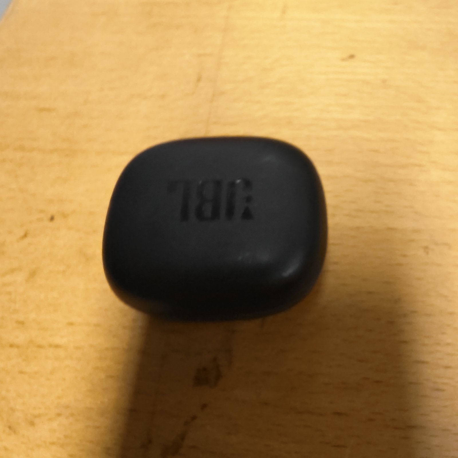 Black wireless earbuds for portable audio listening.