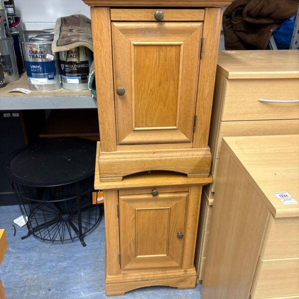 Pair of vintage wooden bedside cabinets with panelled doors.