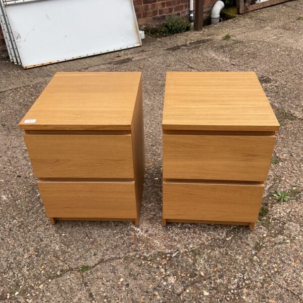 Pair of vintage wooden bedside cabinets for bedroom storage.